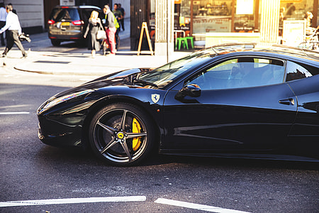 A black Ferrari car on the streets of East London thumbnail