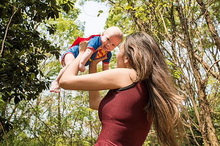 woman carrying baby thumbnail