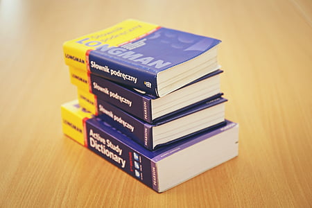 photo of four dictionary on table thumbnail