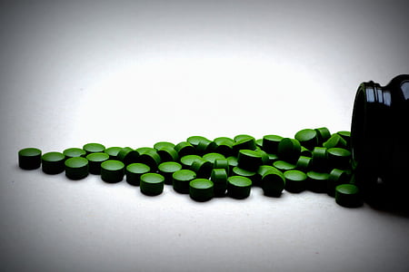 photography of green supplement pills thumbnail
