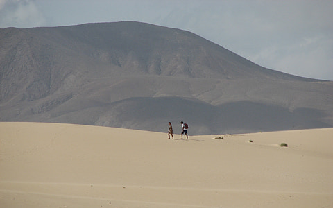 two person walking on dessert thumbnail