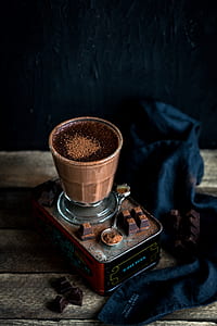 clear footed glass filled with chocolate beverage thumbnail