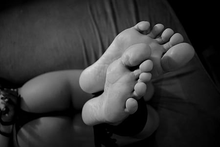 woman wearing g-string with feet tied proning on bed thumbnail