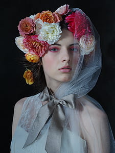 woman wearing floral head dress and white veil thumbnail
