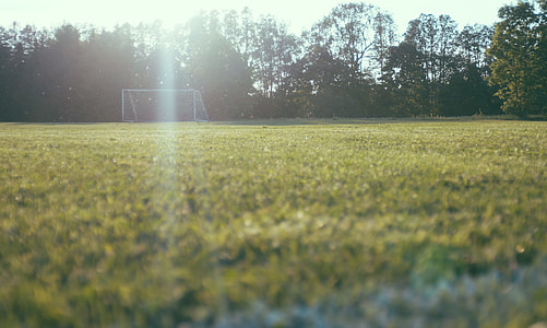 tilt shift lens photography of soccer goal thumbnail