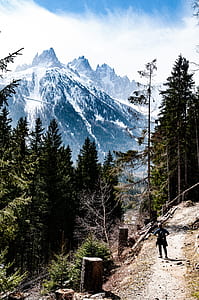 person standing on mountain trail thumbnail
