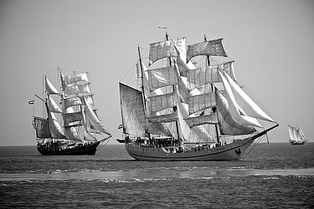 grayscale photography of two galleon ships on sea thumbnail