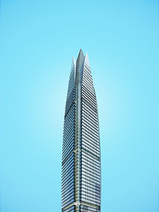 gray curtain wall high-rise building under blue sky thumbnail