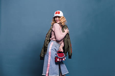 Woman in Pink Sweater and Denim Skirt thumbnail