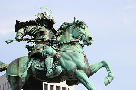 man riding on horse statuette thumbnail