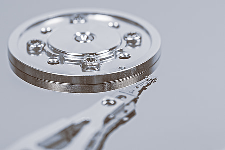 round silver metal component with screws thumbnail