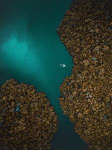 aerial photo of white boat on lake thumbnail