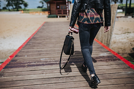 Beautiful blonde woman on a wooden pier by the lake thumbnail