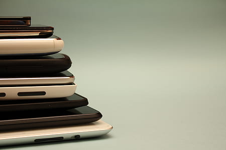 assorted Android smartphone lot on white surface thumbnail