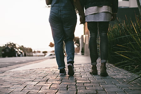 two people walking on pavement thumbnail