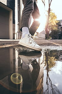 person standing near water during daytime thumbnail