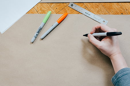 person holding black marker pen thumbnail