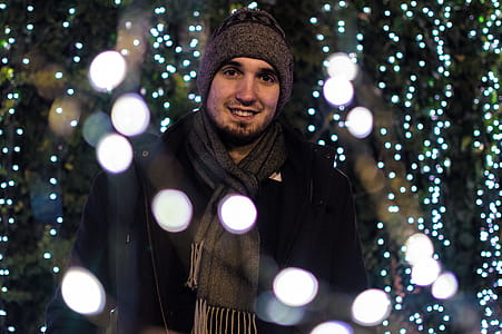 Man Wearing Snow Coat With Bokeh Light Background thumbnail