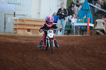 children riding white pocket bike thumbnail