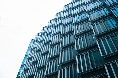gray concrete high-rise building under white sky thumbnail