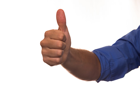 man wears blue dress shirt while doing thumbs up thumbnail
