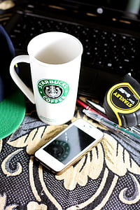 white and green Starbucks mug on table thumbnail