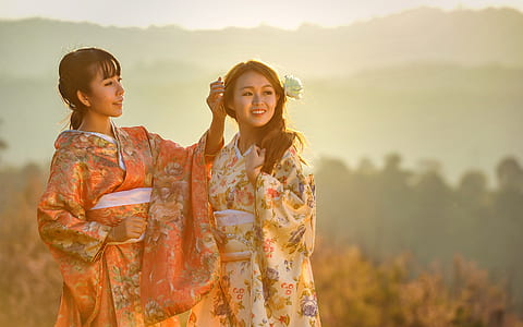 women wearing yellow and orange kimonos thumbnail