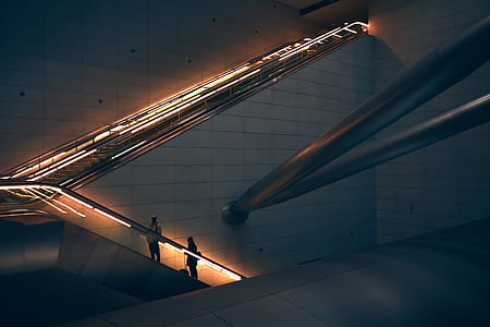 two person riding on escalator thumbnail