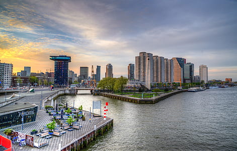 cityscape photography of building near body of water thumbnail