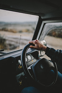 selective focus photography of person driving thumbnail
