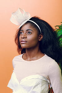 woman in white scoop-neck shirt thumbnail