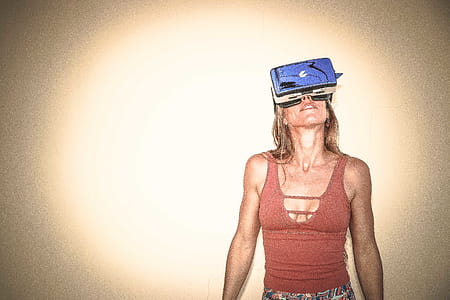 Woman in Brown Cages Sleeveless Top and Blue Virtual Reality Headset thumbnail