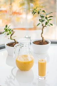 Clear Glass Pitcher With Yellow Fruit Juice thumbnail