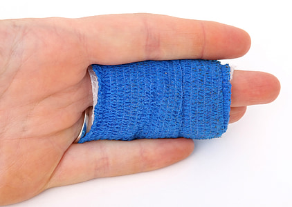 person hand covered by blue textile thumbnail