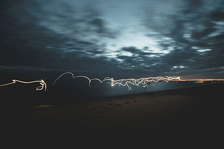 time lapse photography on seashore during night time thumbnail