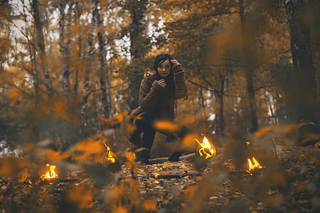 woman doing stunt under tree during daytime thumbnail