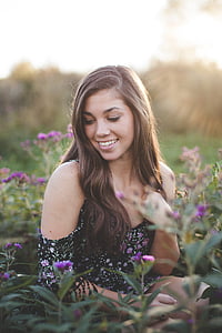 woman standing on flower garden thumbnail