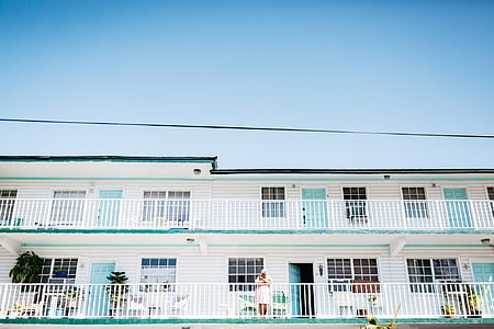 woman standing on concrete house thumbnail