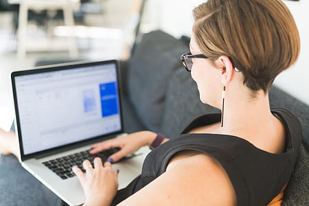 Woman Working On Office Sofa Photo thumbnail