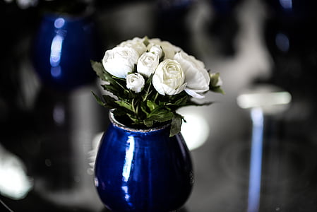 white rose flowers with blue glass vase thumbnail