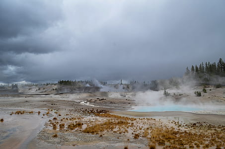 hot springs on gray soil below cloudy sky thumbnail