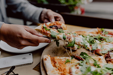 Eating delicious pizza in a cozy restaurant thumbnail