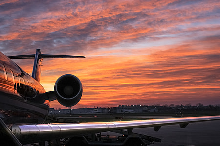 photo of airplane under the sunset thumbnail
