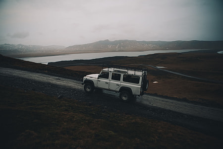 white SUV on road thumbnail