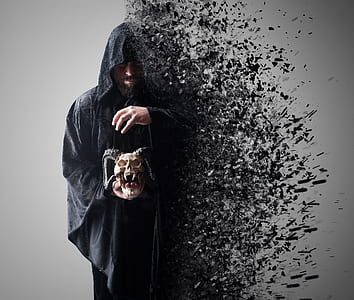 person wearing black suit while holding gray skull thumbnail