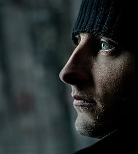 man wearing black knit cap thumbnail