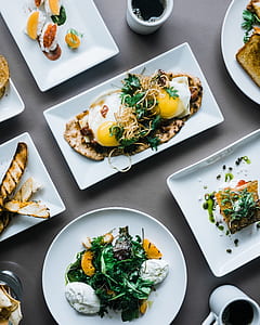 fried egg serve on white plate with green herbs thumbnail