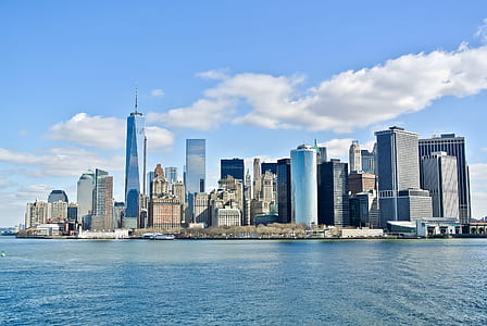 daytime cityscape by water thumbnail