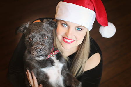 woman holding black dog thumbnail