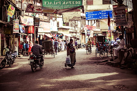 woman standing in the middle of r oad during daytime thumbnail